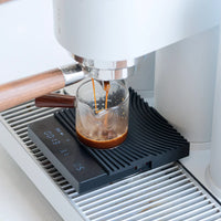Timemore Basic 3.0 coffee scale fitted to espresso machine drip tray weighing a double espresso shot in Espresso Mode
