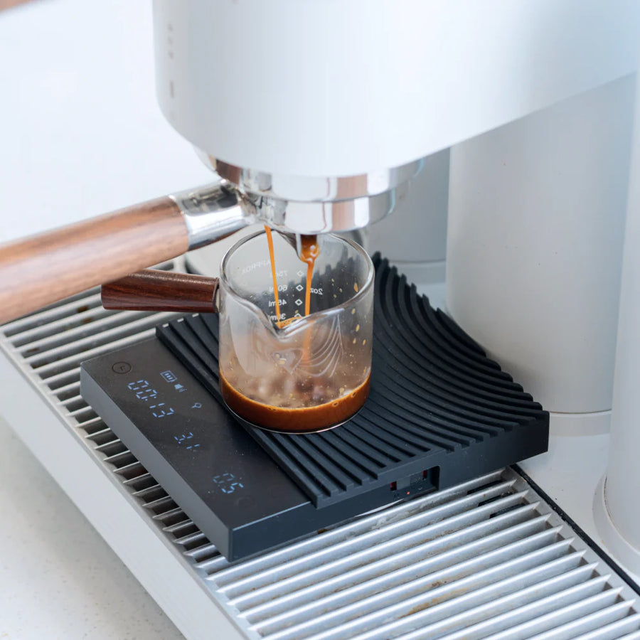 Timemore Basic 3.0 coffee scale fitted to espresso machine drip tray weighing a double espresso shot in Espresso Mode
