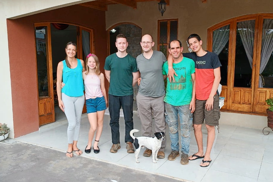 Ozone Head of eCommerce Chris Price and Ozone Green Buyer Roland Glew with Allan Oviedo, his wife Daysi, and their family, at his family home only a mile from his farms and micromill