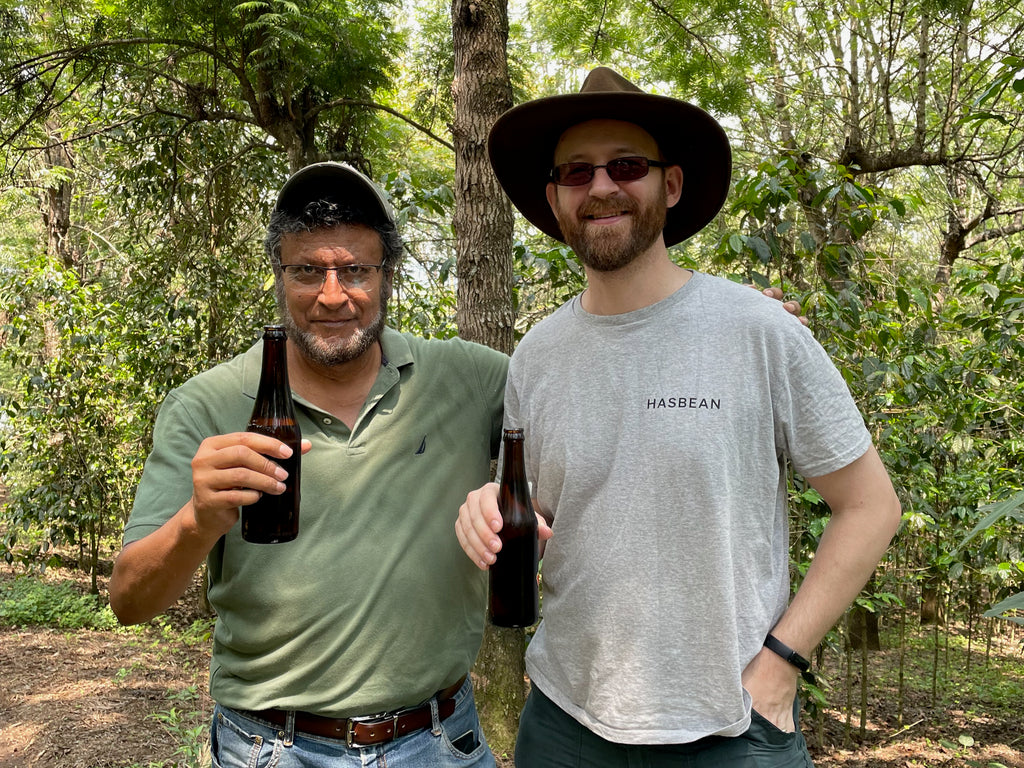 Francisco Flores and Hasbean Green Buyer Roland Glew enjoying beer together at El Bosque in Amatitlán, Guatemala